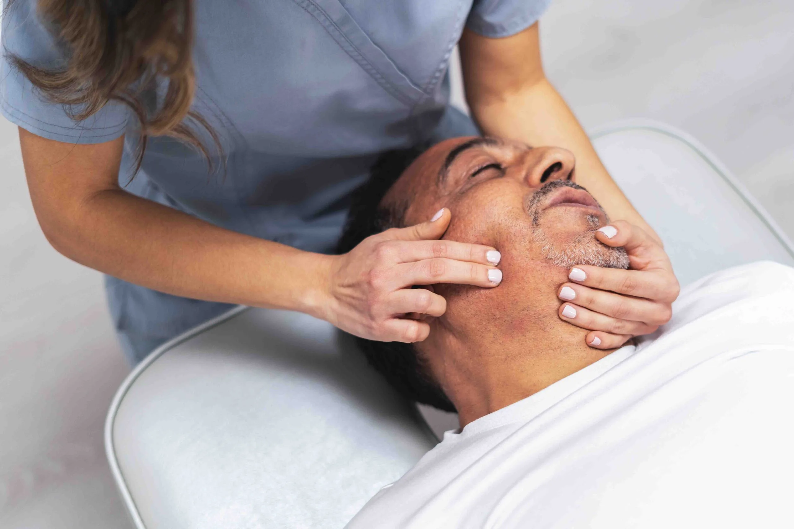 physiotherapist-massaging-patient-s-face-in-clinic-2025-04-28-23-05-38-utc_11zon physiotherapist-massaging-patient-s-face-in-clinic-2025-04-28-23-05-38-utc_11zon